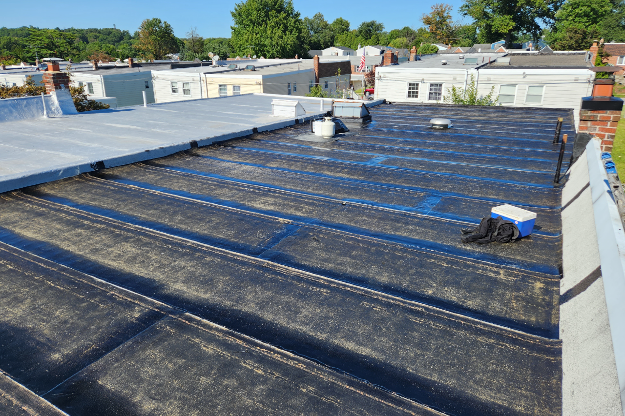 Roof Condensation vs. Active Roof Leaks shown in a realistic Philadelphia, PA residential construction setting.